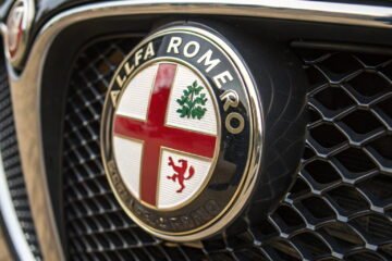 cross and snake car logo